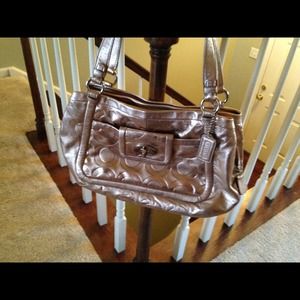 Metallic Coach purse. Not a knock off