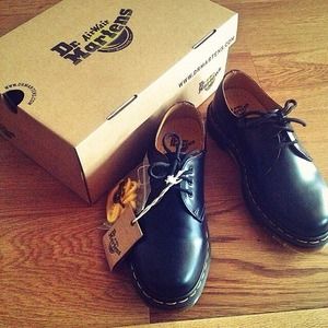 Black Doc Marten low tops.