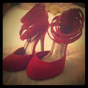 Red pumps with ankle straps