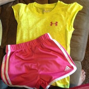 Under armer shirt and Adidas shorts.