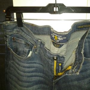 Darker washed denim with faded thighs and knees