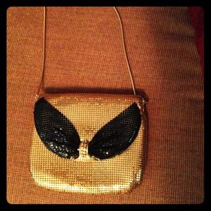 Gold and shiny handbag!