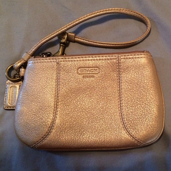 Authentic gold coach wristlet