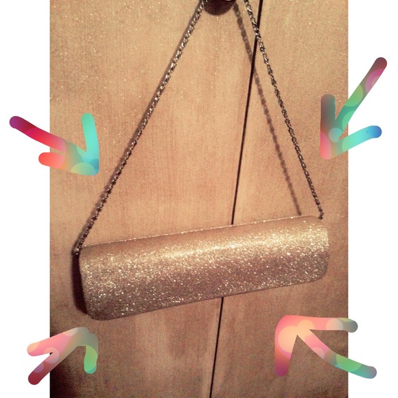 Gold sparkly clutch with gold chain strap.