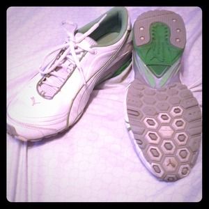 White and green Puma tennis shoes