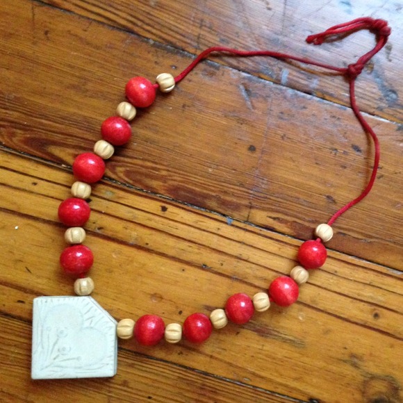 Wooden bead necklace with ceramic pendant