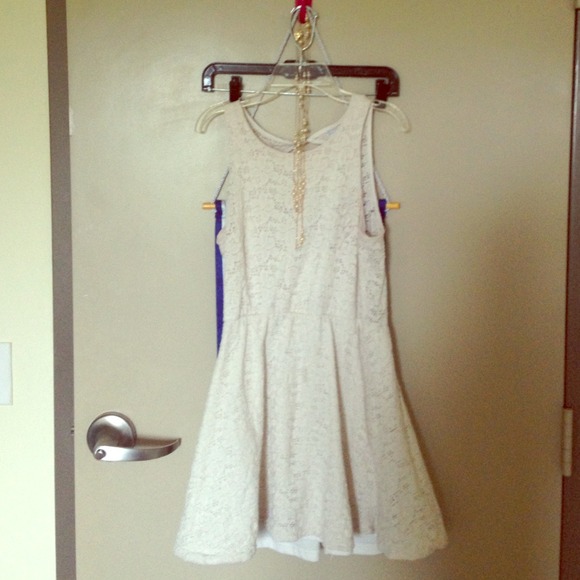 White timeless dress, cut out in the back.