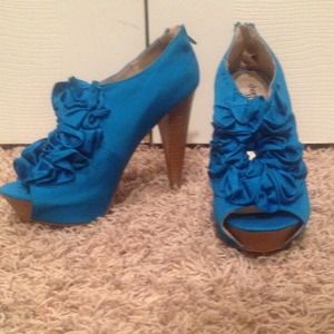 Teal ruffled high heels