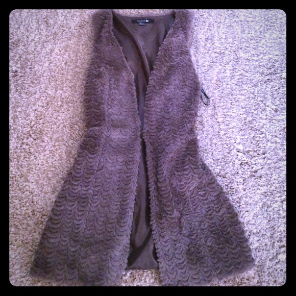 Sleeveless faux fur over coat