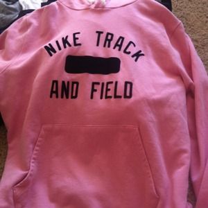 Pink Nike track and field pull over hoodie