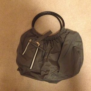 Grey purse with black handles