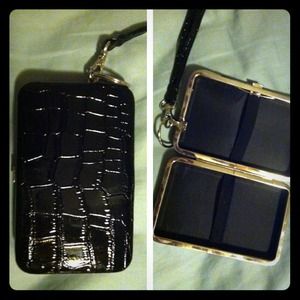Little black wristlet, holds cards and an iPhone!
