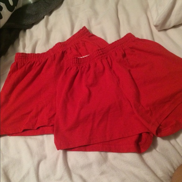 Two pairs of red soffe shorts