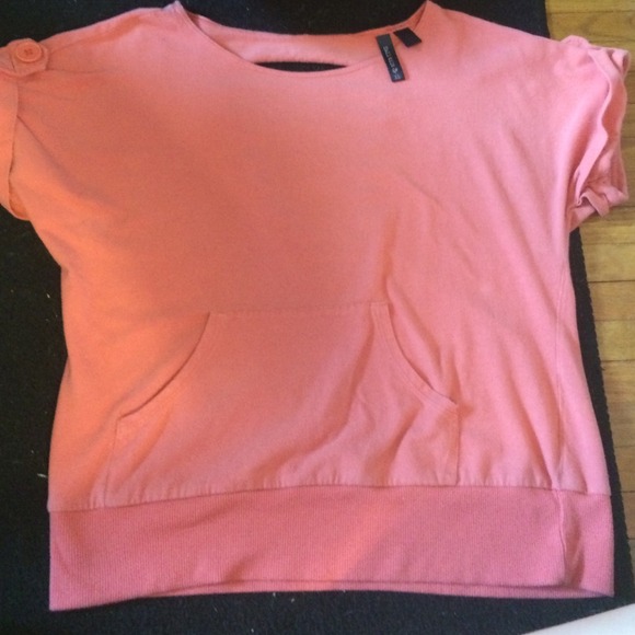light pink shirt with cutouts