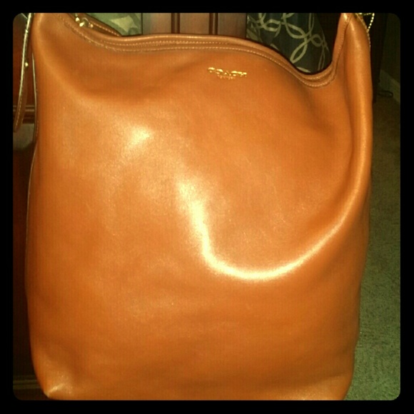 Brown leather coach -