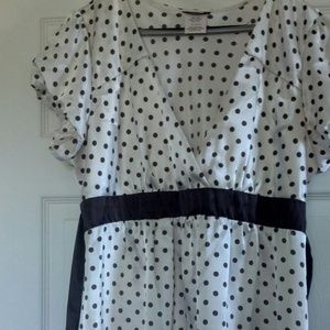 Cream top with brown polka dots.