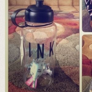 Pink water bottle and dog