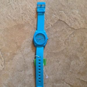 Nixon blue watch.