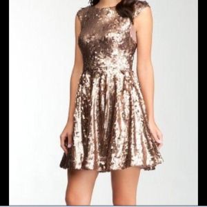 BRAND NEW gold bebe dress