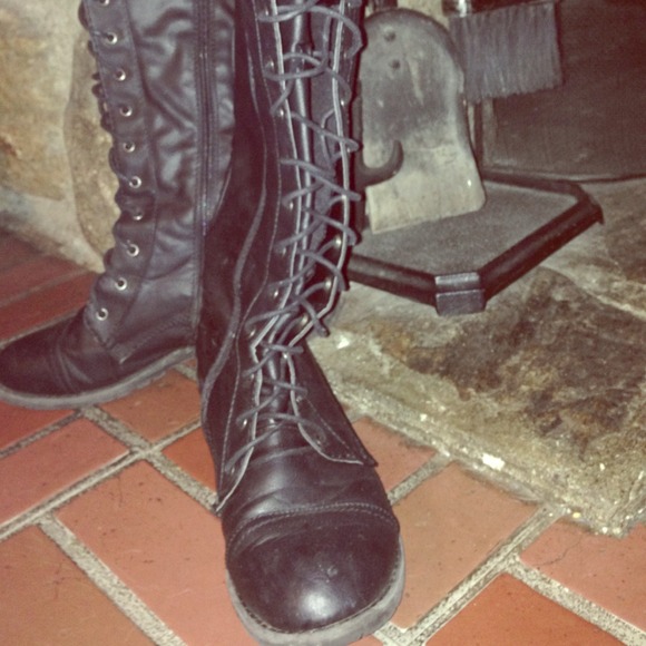 Tall black combat boots