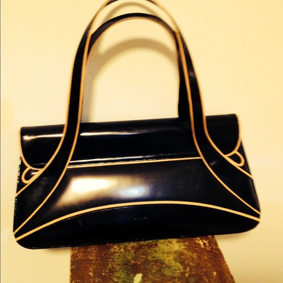Stunning BCBG leather black & tan handbag.