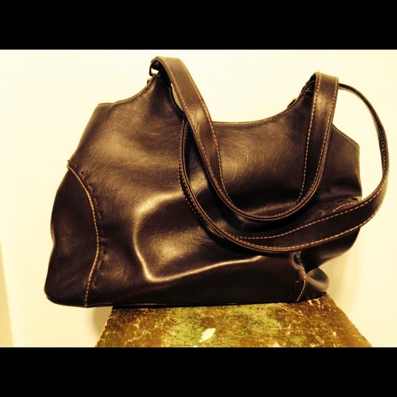 Brown suede purse with detailed stitching.