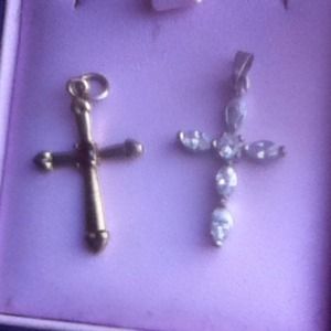 Free w/ purchase. Two cross pendents.