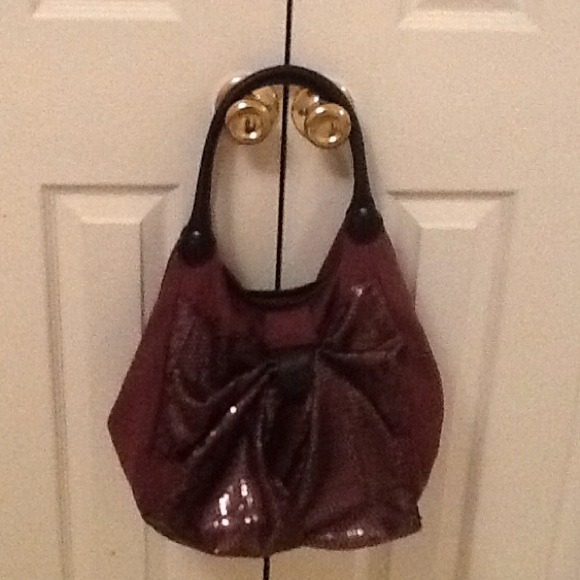 Purse...Dark purple with black straps.