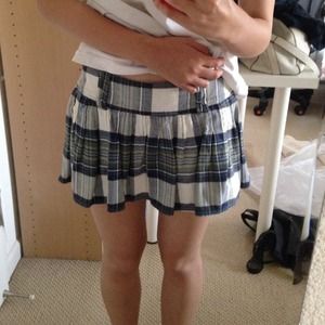 Plaid mini skirt with belt.