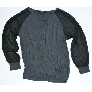 Grey loosely fitted top. Black mesh sleeves.