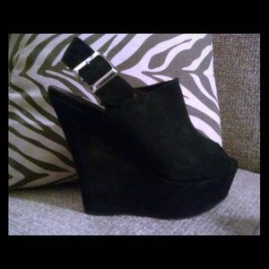 Black suede platform wedges by Steve Madden.