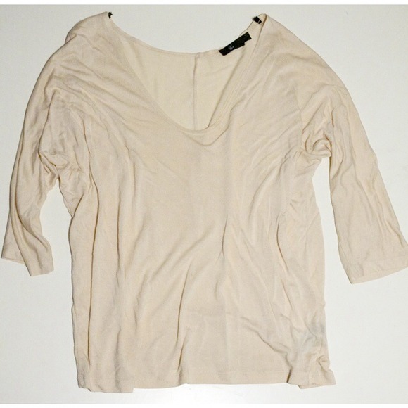 Loosely fitted droop neck.