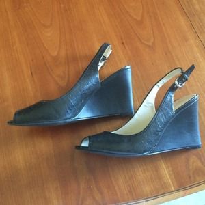 Black wedge heels. Open toe.