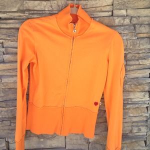 Bright orange zip up
