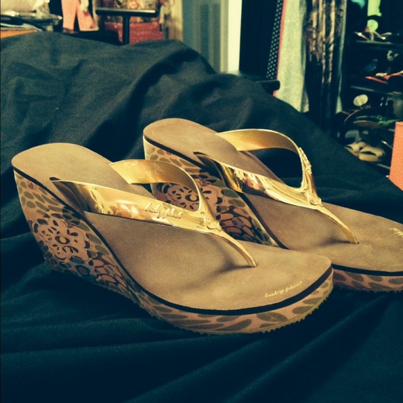 Baby phat wedged flip flops.