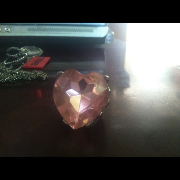 Pink heart ring.