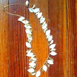 White and gold-colored leaf necklace :)