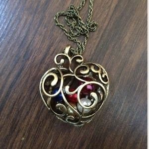 Antique gold heart necklace w/ enclosed pearls.