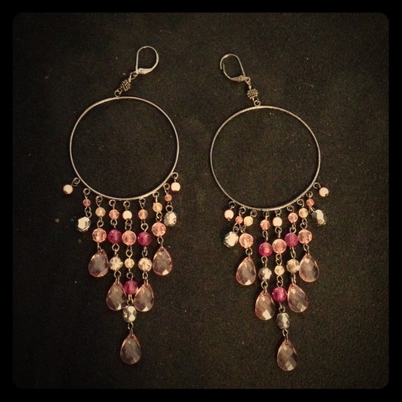 long pink dangling hoop earrings.