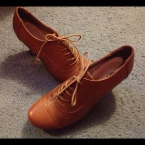 Brown leather Oxford heels.