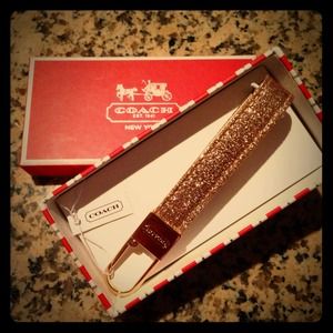 Gold glitter coach keychain.