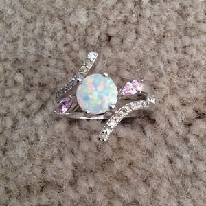 White fire opal with cute design.