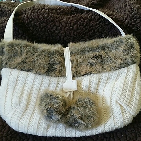 Cream colored purse with fake fur trim