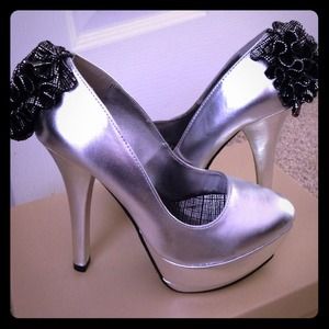 Michael Antonio platform silver heels. Size 6.5