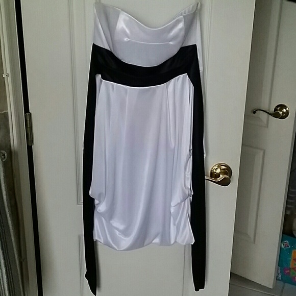 White satiny strapless dress with black tie belt