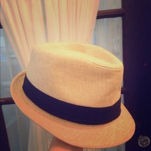 Tan and black fedora hat