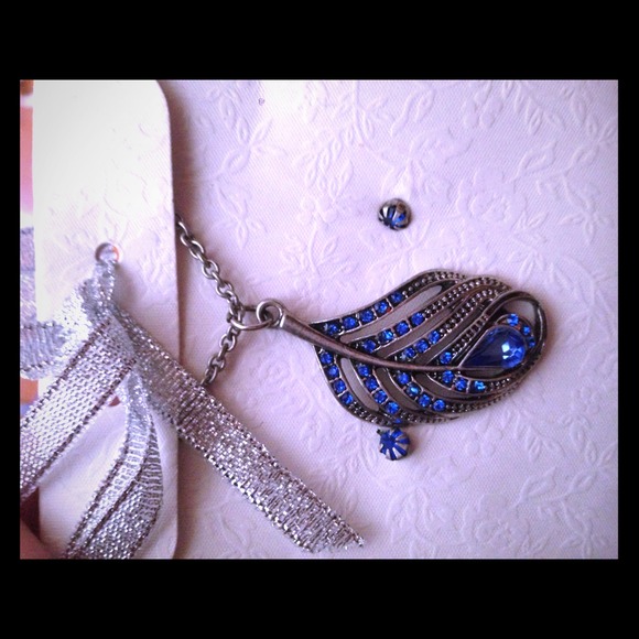 Silver feather with blue and matching earrings