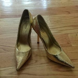 Guess Gold snake skin shoes.
