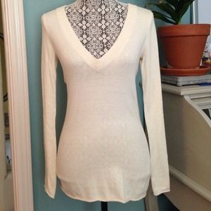 Cream and brown sweaters