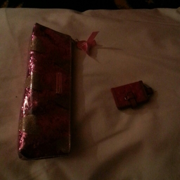 A Victoria's secret makeup bag and a coach keychai